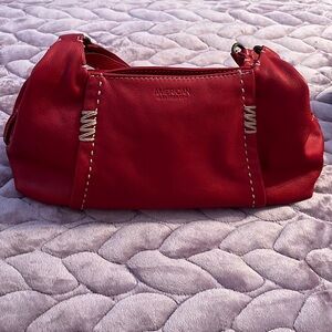 Red leather shoulder bag.